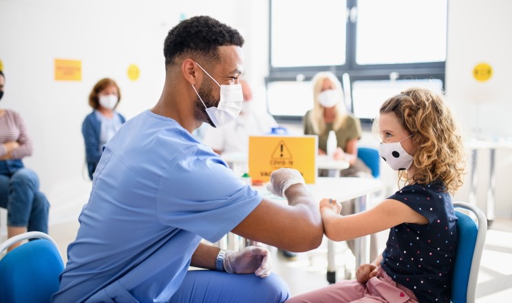CTE trained student working in his career providing vaccines