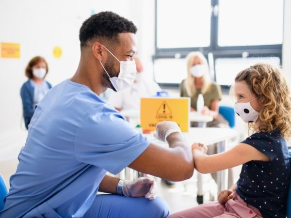 CTE trained student working in his career providing vaccines
